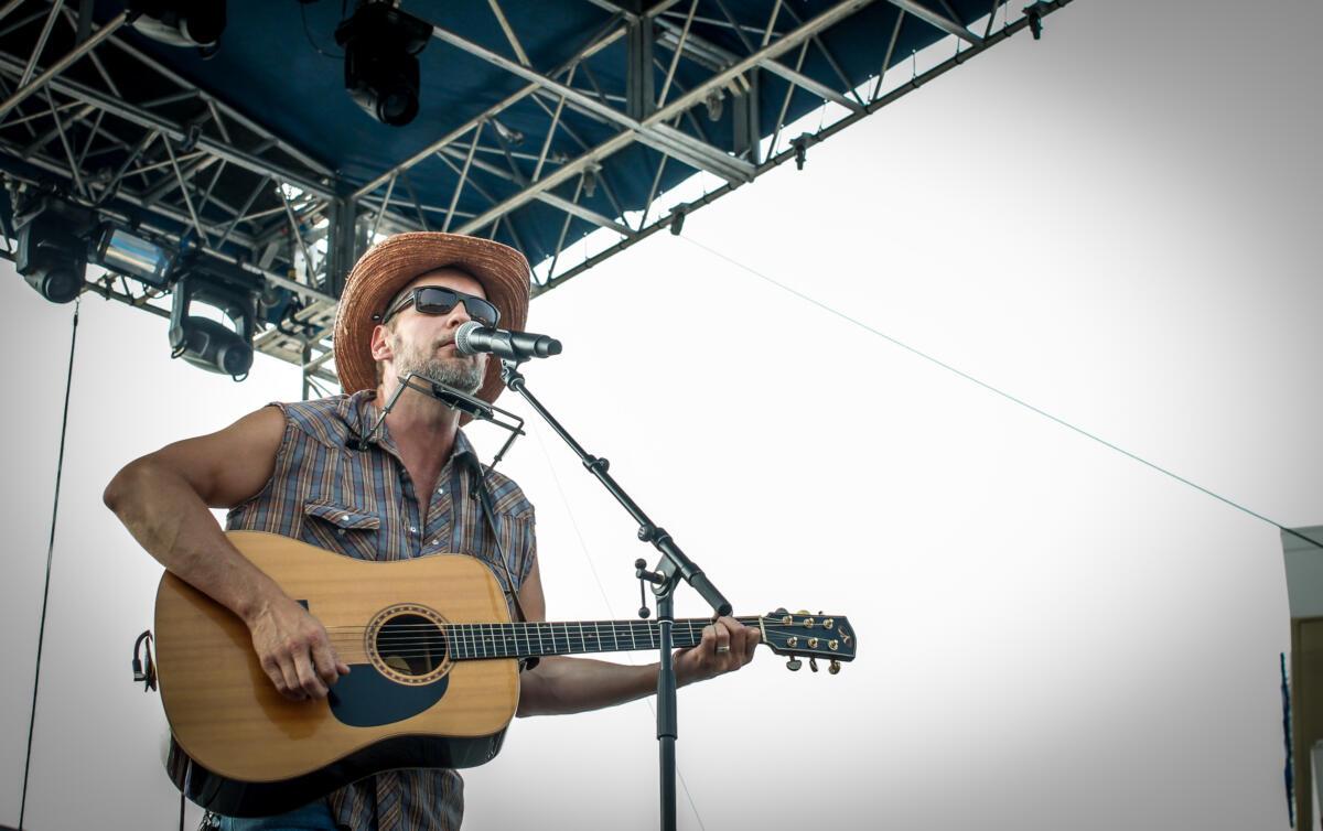 Omaha singer-songwriter Matt Cox performs at Maha Festival at Stinson Park in Omaha, Neb.