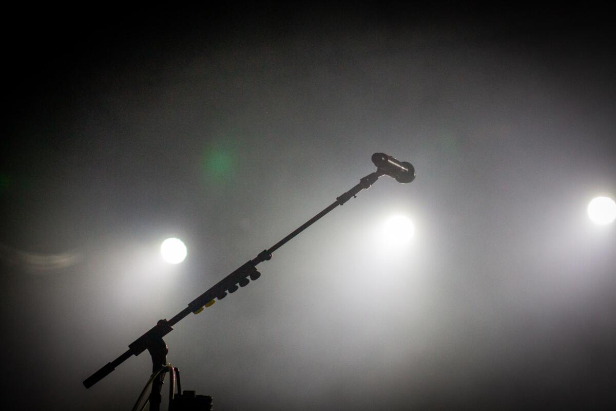 A lonely microphone waits on stage before Lord Huron performs at Outlandia Festival on Aug. 11, 2023. 